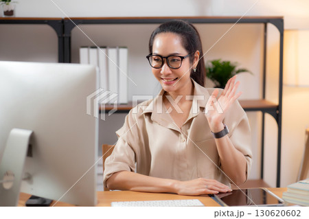 Professional young asian businesswoman video call for interview in modern home office. Professional young asian businesswoman video call for interview in modern home office. 130620602