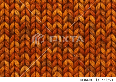 Cozy macro of chunky knitted wool in warm amber and rust tones. 130621794