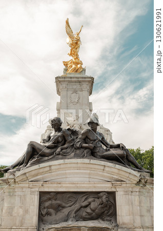 The bronze figure of Victory is prominently featured atop the Victoria Memorial accompanied by The armored figure with a helmet and sword and woman. 130621991