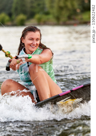 Woman enjoying water sports on a sunny day 130622482
