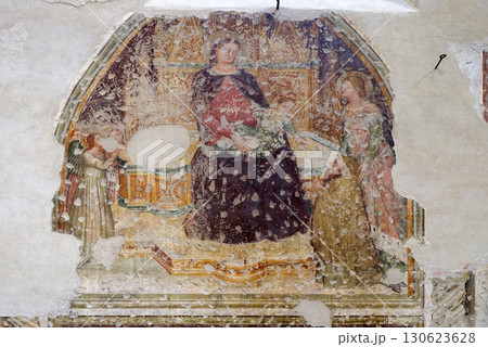 Enthroned Madonna and Child with five angels, Saint Catherine and a worshipper, fresco in the church of San Pietro Martire in Verona, Italy 130623628