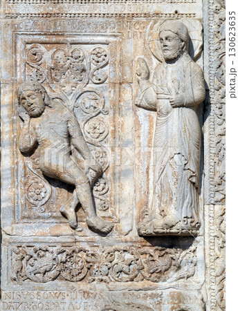 Creation of Adam, medieval relief on the facade of Basilica of San Zeno in Verona, Italy 130623635