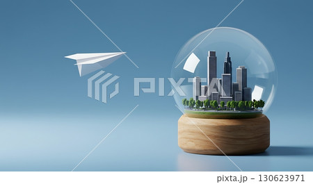 Miniature Cityscape Inside Glass Globe with Paper Plane in Conceptual Scene 130623971