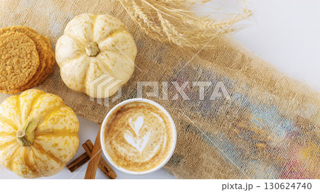 Autumn flat lay with pumpkin spice cookies and latte cup on linen cloth with soft shadows cozy background perfect for seasonal greeting card design fall food advertising or festive branding project 130624740