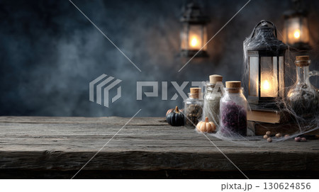 Halloween background with copy-space for text. Vintage wooden table with cobwebbed lanterns and potion ingredients, gothic style. 130624856