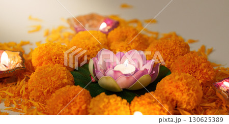 Lotus Flower Candle. A beautiful lotus candle surrounded by marigold flowers for Diwali. Lotus Flower Candle. A beautiful lotus candle surrounded by marigold flowers for Diwali. 130625389