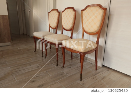 Renewal of old vintage furniture. Chairs and white covers. Interior design in apartment. Renewal of old vintage furniture. Chairs and white covers. Interior design in apartment. 130625480