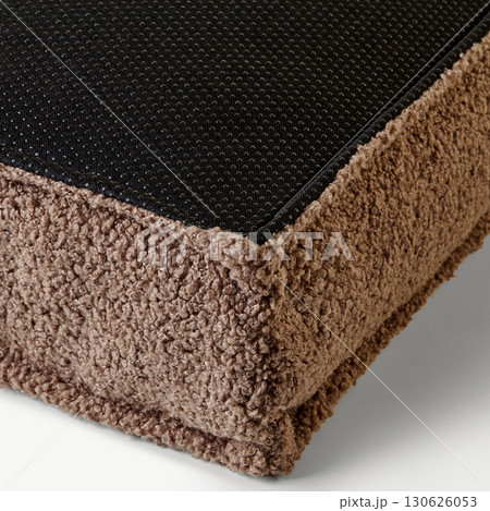 Comfortable brown pet bed providing rest and relaxation 130626053