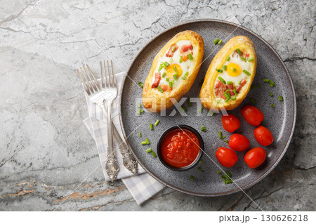 Egg Stuffed Baked Potatoes closeup on the plate. Horizontal top view Egg Stuffed Baked Potatoes closeup on the plate. Horizontal top view 130626218