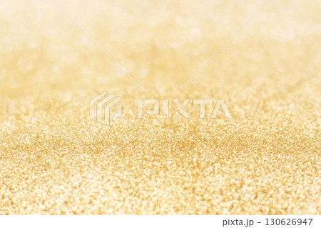 Bright golden glittery surface suitable for festive and celebratory design backgrounds 130626947