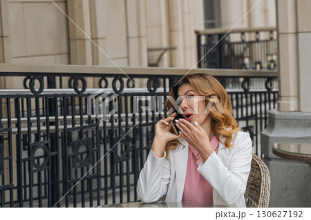 Woman Phone Call Outdoor Cafe Surprised Expression Woman Phone Call Outdoor Cafe Surprised Expression 130627192