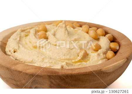 Hummus in bowl, houmous dip, chickpea humus tahini sauce, middle eastern spread Hummus in bowl, houmous dip, chickpea humus tahini sauce, middle eastern spread 130627261