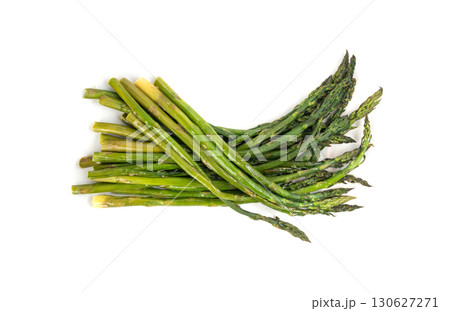 Cooked asparagus isolated. Roasted green vegetable for salad, baked asparagus bunch Cooked asparagus isolated. Roasted green vegetable for salad, baked asparagus bunch 130627271