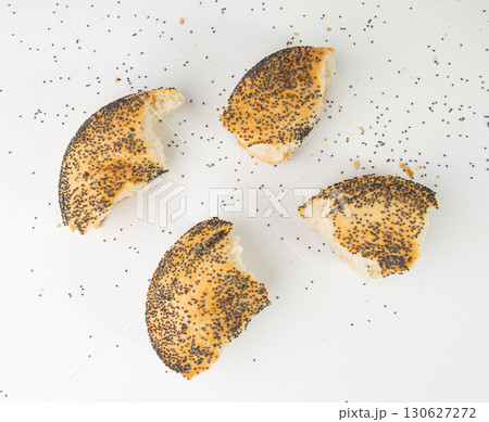 Broken Poppy Seed Bagel Isolated, Round Bread Bun, Poppyseed Wheat Bakery Pieces for Breakfast Broken Poppy Seed Bagel Isolated, Round Bread Bun, Poppyseed Wheat Bakery Pieces for Breakfast 130627272