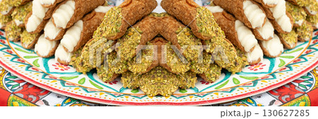 Cannoli with pistachios and ricotta. Sicilian dessert cannolo, fresh sweet cannoli pile 130627285