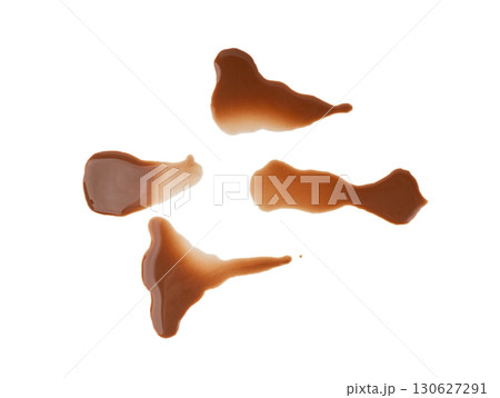 Spilled chocolate milk isolated, hot chocolate puddle, liquid stain, coffee splatter, brown latte Spilled chocolate milk isolated, hot chocolate puddle, liquid stain, coffee splatter, brown latte 130627291