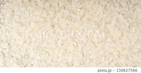 Raw flattened rice textured background. Dry...の写真素材 [130627566] - PIXTA