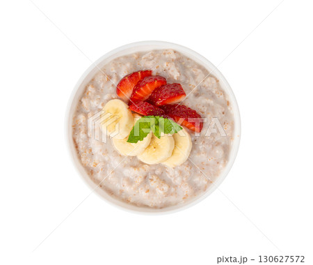 Cooked spelt in bowl isolated. Oatmeal milk porridge with fruits and berries Cooked spelt in bowl isolated. Oatmeal milk porridge with fruits and berries 130627572
