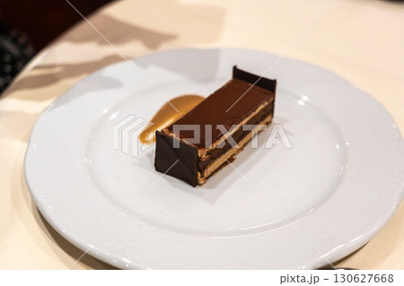 A piece of chocolate cake that looks like a bed 130627668