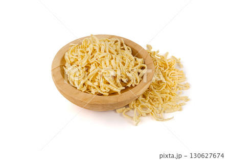Passatelli spatzle pasta isolated, raw spaetzle noodles, dry homemade german macaroni Passatelli spatzle pasta isolated, raw spaetzle noodles, dry homemade german macaroni 130627674