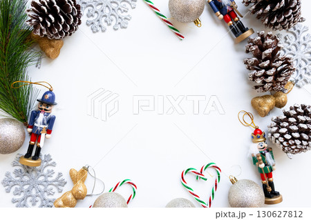 Festive Christmas arrangement with nutcrackers, pinecones, and snowflakes Festive Christmas arrangement with nutcrackers, pinecones, and snowflakes 130627812