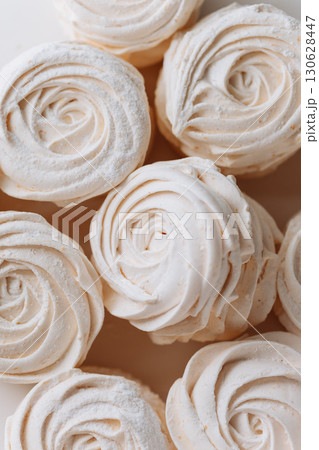 Delicate white marshmallow dessert in natural light, close-up of airy texture and swirl shape 130628447