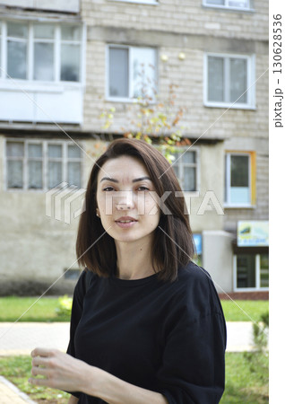 Beautiful woman with bob haircut looks attentively Beautiful woman with bob haircut looks attentively 130628536
