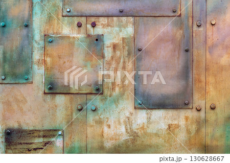 Abstract industrial background of rusty metal plates with bolts and textured surface. Concept of grunge design, urban texture, industrial construction background, copy space 130628667