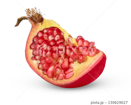 Pomegranate wedge with some isolated seeds. Pomegranate cut Pomegranate wedge with some isolated seeds. Pomegranate cut 130629027