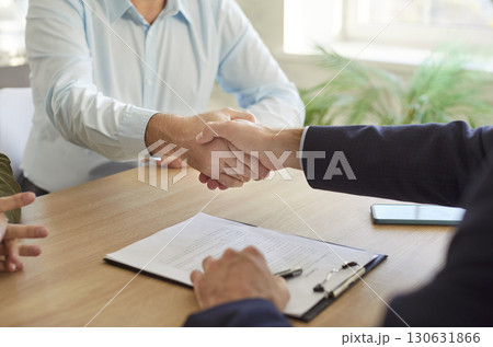 Handshake deal, people get acquainted with real estate agent, meeting together in office, shake hand 130631866