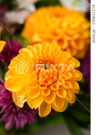 Autumn Fall Bouquet for Thanksgiving holiday. Seasonal Warm colorful blossom flowers arrangement festive decoration. Selective Autumn Fall Bouquet for Thanksgiving holiday. Seasonal Warm colorful blossom flowers arrangement festive decoration. Selective 130632218