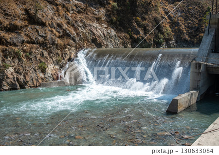 Langtang Khola hydroelectric small dam in Langtang national park, Nepal. The purpose of producing hydroelectric power, dams are created to control river flow and regulate flooding. Langtang Khola hydroelectric small dam in Langtang national park, Nepal. The purpose of producing hydroelectric power, dams are created to control river flow and regulate flooding. 130633084