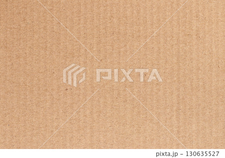 Brown cardboard sheet abstract background, texture of recycle paper corrugated box in old vintage pattern. 130635527