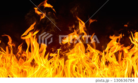 Dramatic red, orange, yellow flame and smoke rising against a dark background. Realistic, abstract fire burning background texture overlay. Vivid and hot hell or blazing fire wallpaper Dramatic red, orange, yellow flame and smoke rising against a dark background. Realistic, abstract fire burning background texture overlay. Vivid and hot hell or blazing fire wallpaper 130636704