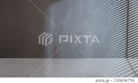 Striking light beam shines across the interior of the room with concrete walls. Mockup, copy space, or template. Empty backdrop podium for product or text display 130636756