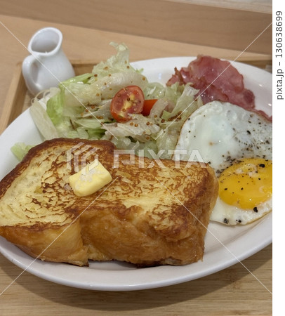 A delightful brunch spread featuring a mix of savory and sweet bites. perfectly toasted bread, fresh fruits, soft scrambled eggs, and a refreshing drink to brighten your late morning. 130638699