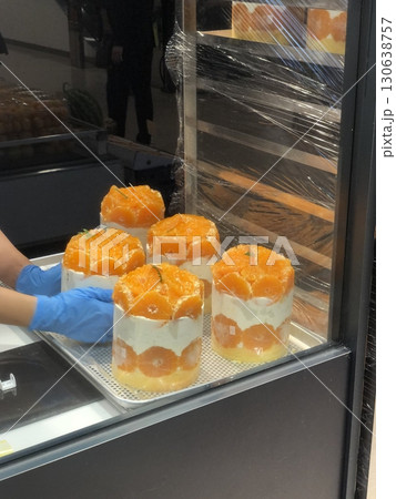 Light and fluffy mango shortcake with soft sponge layers, fresh mango slices, and creamy whipped filling. A perfect blend of tropical sweetness and airy texture for a refreshing dessert. 130638757