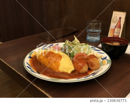 Omurice is an example of yoshoku consisting of an omelette made with fried rice and usually topped with ketchup or demi glace sauce. 130638771