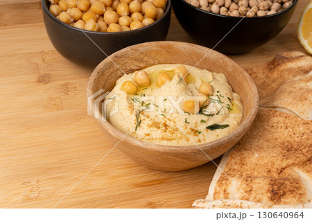 Hummus in bowl, houmous dip, chickpea humus tahini sauce, middle eastern spread 130640964