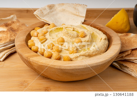 Hummus in bowl, houmous dip, chickpea humus tahini sauce, middle eastern spread Hummus in bowl, houmous dip, chickpea humus tahini sauce, middle eastern spread 130641188