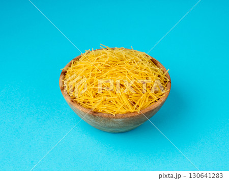 Raw vermicelli, gold soup pasta, small homemade noodles, thin Italy macaroni Raw vermicelli, gold soup pasta, small homemade noodles, thin Italy macaroni 130641283