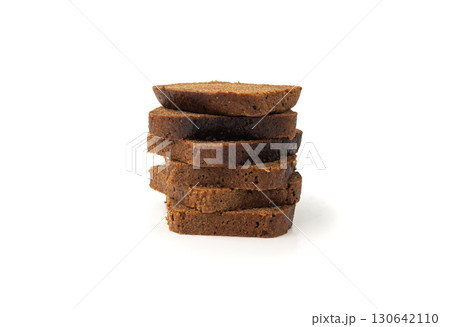 Black rye bread isolated, dark brown sliced loaf, sourdough borodinsky rugbrod square slices 130642110