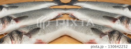 Fish scales texture background, sea bass skin close up, macro shot of silver labrax scale Fish scales texture background, sea bass skin close up, macro shot of silver labrax scale 130642252