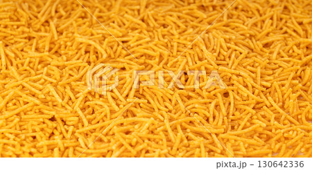Aloo bhujia indian snack isolated. Crispy potato and chickpea flour strips, alu bhujiya sev Aloo bhujia indian snack isolated. Crispy potato and chickpea flour strips, alu bhujiya sev 130642336