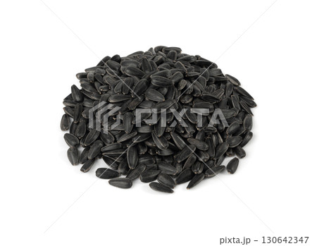 Sunflower seeds pile isolated, black oil sun flower grains group with shell, fresh edible oil seeds heap 130642347