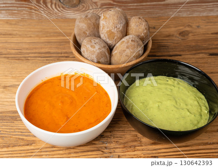 Red mojo rojo and green mojo verde sauces, traditional Tenerife dips, mojo picon dressing Red mojo rojo and green mojo verde sauces, traditional Tenerife dips, mojo picon dressing 130642393