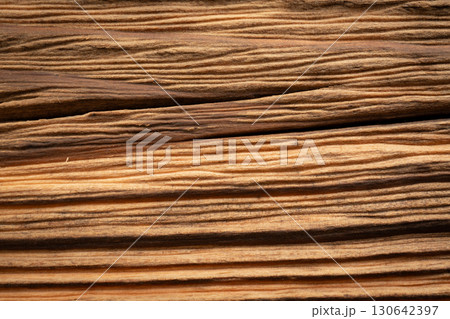 Old wood textured background. Dark driftwood surface, burnt wood brushing, macro brown floor Old wood textured background. Dark driftwood surface, burnt wood brushing, macro brown floor 130642397