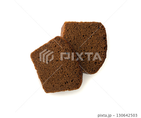 Black rye bread isolated, dark brown sliced loaf, sourdough borodinsky rugbrod square slices Black rye bread isolated, dark brown sliced loaf, sourdough borodinsky rugbrod square slices 130642503