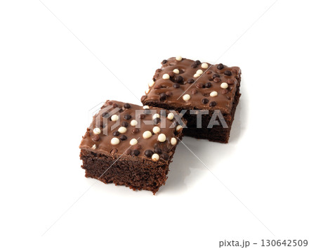 Chocolate brownie cake sprinkled with white and dark balls, classic birthday brownie square piece Chocolate brownie cake sprinkled with white and dark balls, classic birthday brownie square piece 130642509