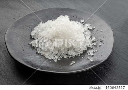 Dead sea salt pile, white crystals for body spa, sodium chloride similar to crushed ice, spa scrub Dead sea salt pile, white crystals for body spa, sodium chloride similar to crushed ice, spa scrub 130642527